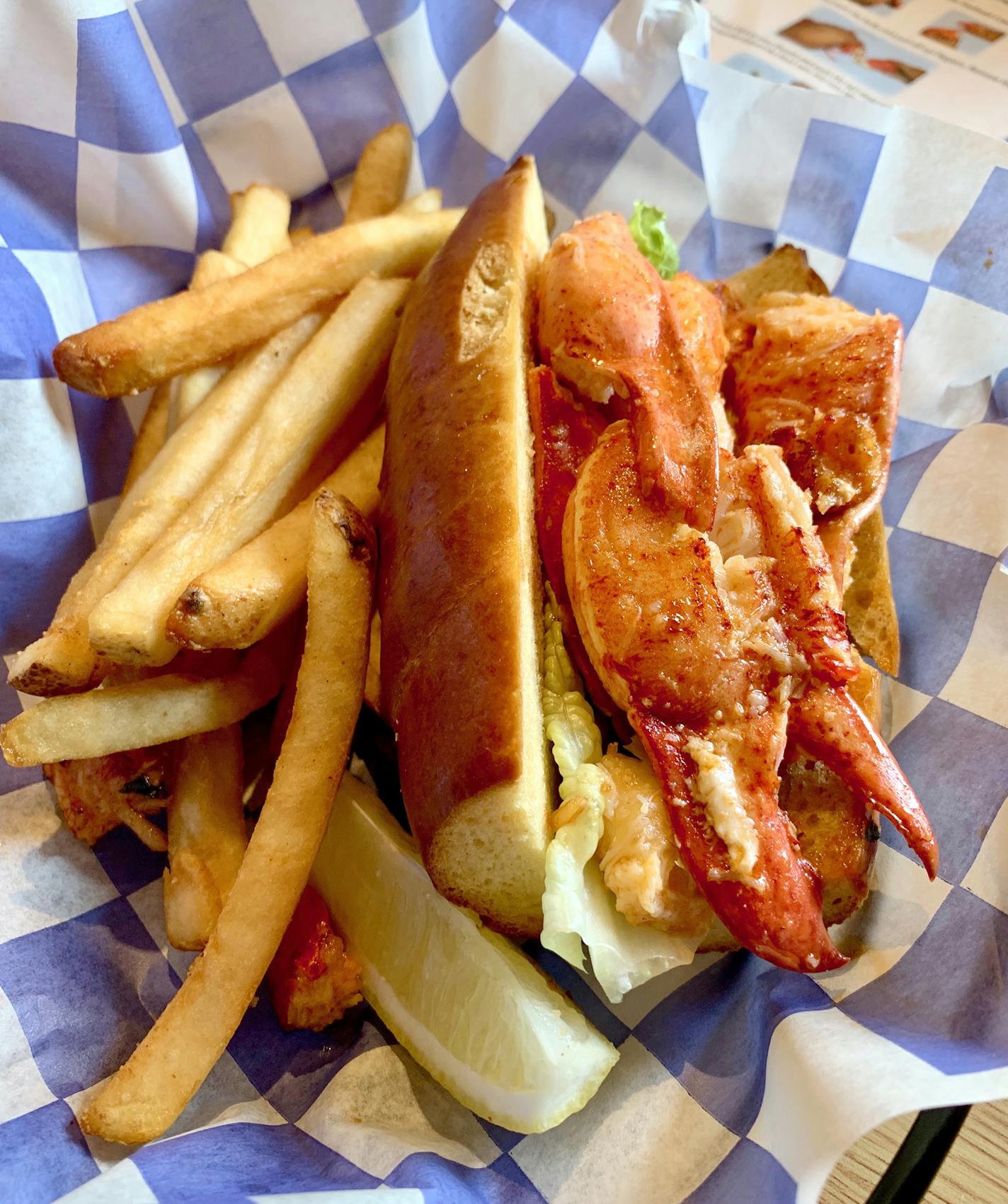 Lobster rolls can be served hot or cold. A hot one is typically served on a toasted, butter-soaked bun. Photo by Jennifer Jeanne Patterson