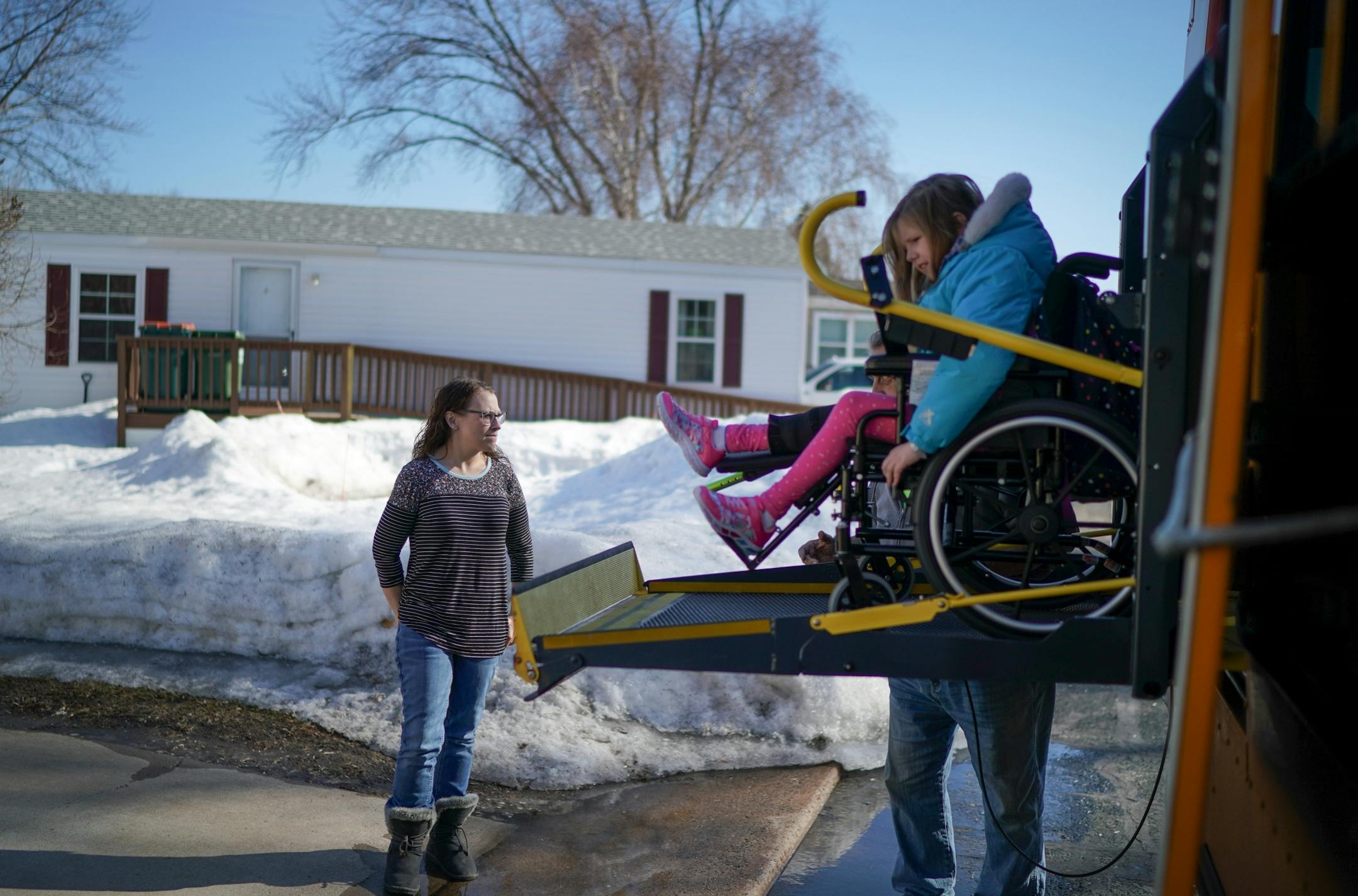 Linsey Rippy waited for her youngest daughter Sydney, 9, to get off the school bus after school. Sydney, 9, is a 3rd grader.