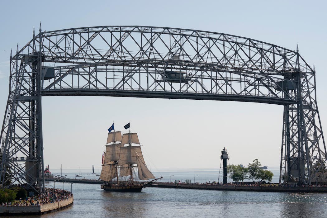 A ship built in the early 1800s crosses beneath the Aerial Lift Bridge during the Festival of Sail in Duluth in 2019.