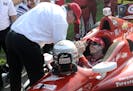 Car owner Chip Ganassi congratulates Scott Dixon, of New Zealand, after Dixon won the IndyCar Honda Indy 200 auto race in Lexington, Ohio, on Sunday. 