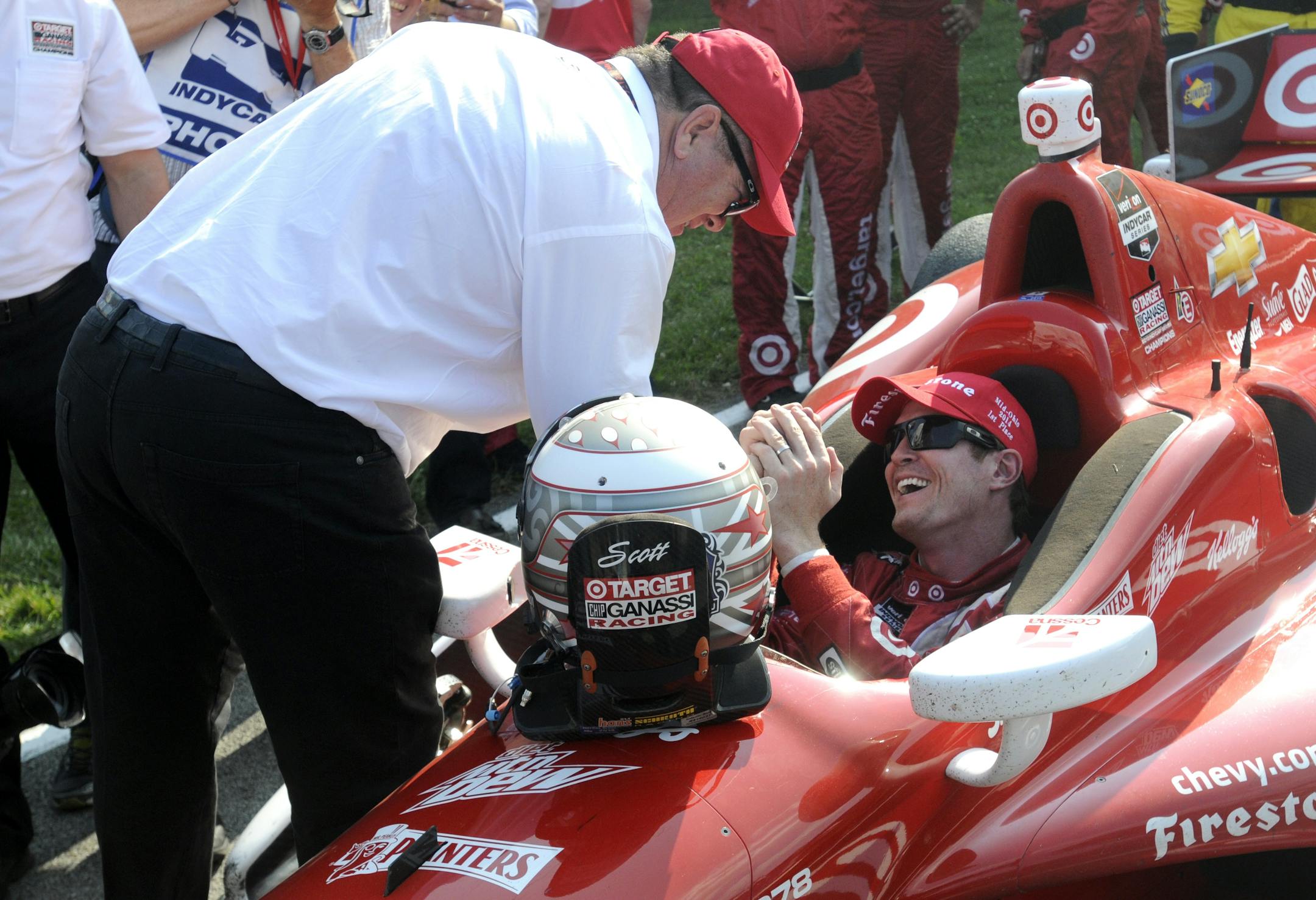 Car owner Chip Ganassi congratulates Scott Dixon, of New Zealand, after Dixon won the IndyCar Honda Indy 200 auto race in Lexington, Ohio, on Sunday. Dixon won the race from the last starting place on the grid.