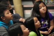 Students at Phalen Lake Hmong Studies Magnet in St. Paul listened as Gia Vang, former KARE-11 news anchor, read to students in March.