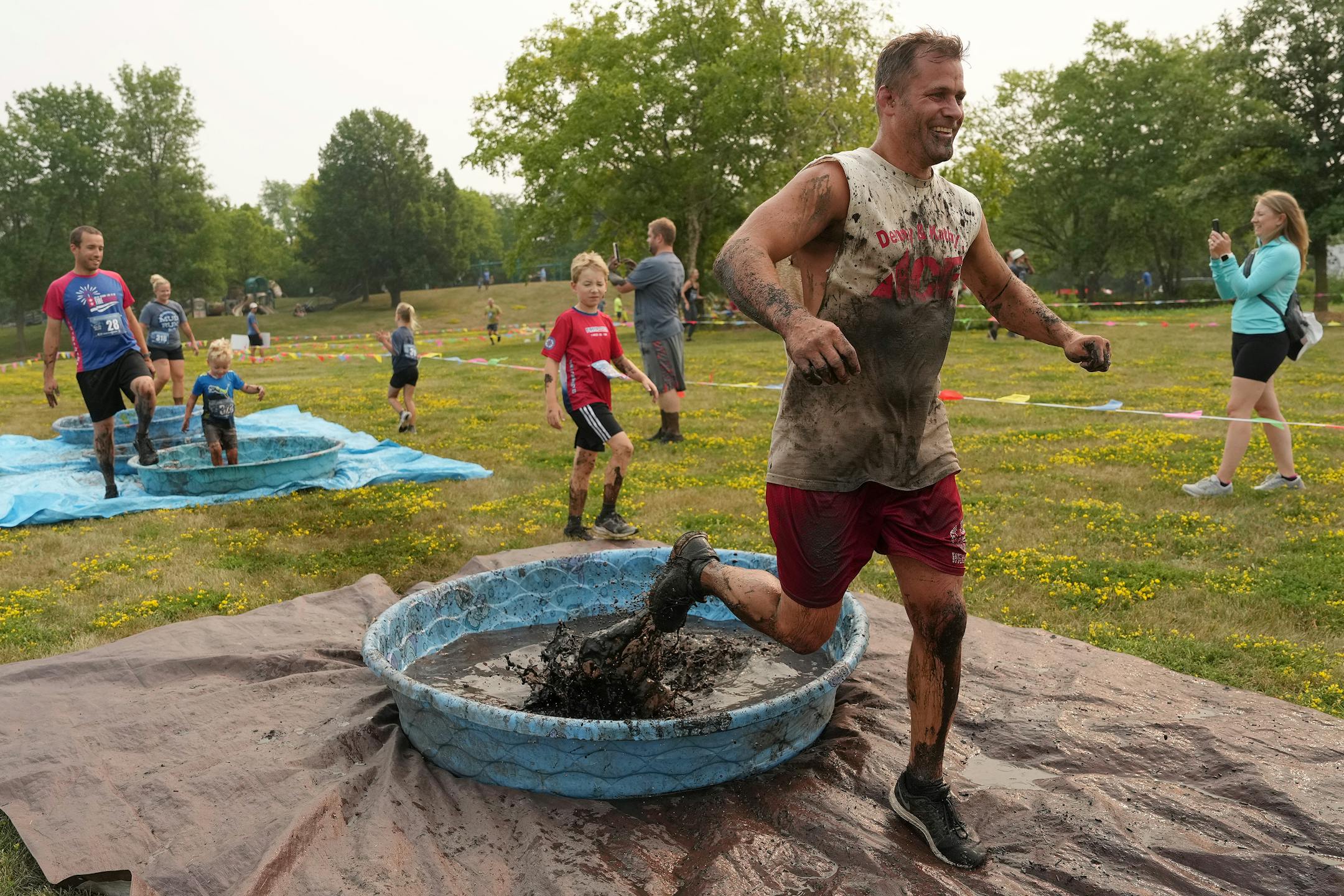 Mike Timm splashes his way through the last of the mud pits after getting an early lead.