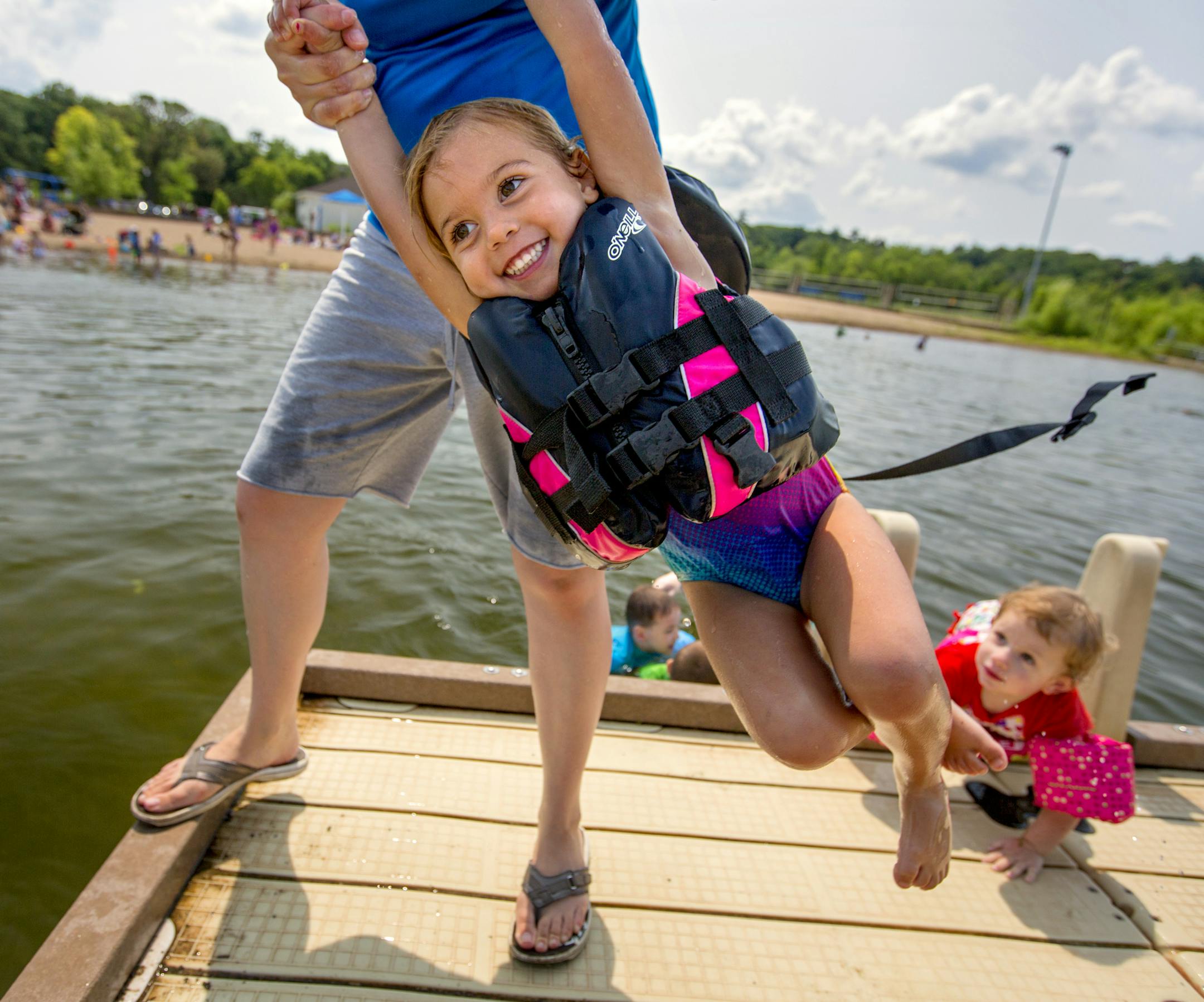 After a dozen years on the state's Impaired Waters List, Wirth Lake has finally been removed this year after an effort by local agencies to mitigate phosphorus levels. The lake is popular with swimmers, fishermen and hikers. Here, 3-year-old Charlotte West gets a friendly toss into Wirth Lake Wednesday afternoon. ] BRIAN PETERSON ‚Ä¢ brian.peterson@startribune.com Minneapolis, MN 07/30/14