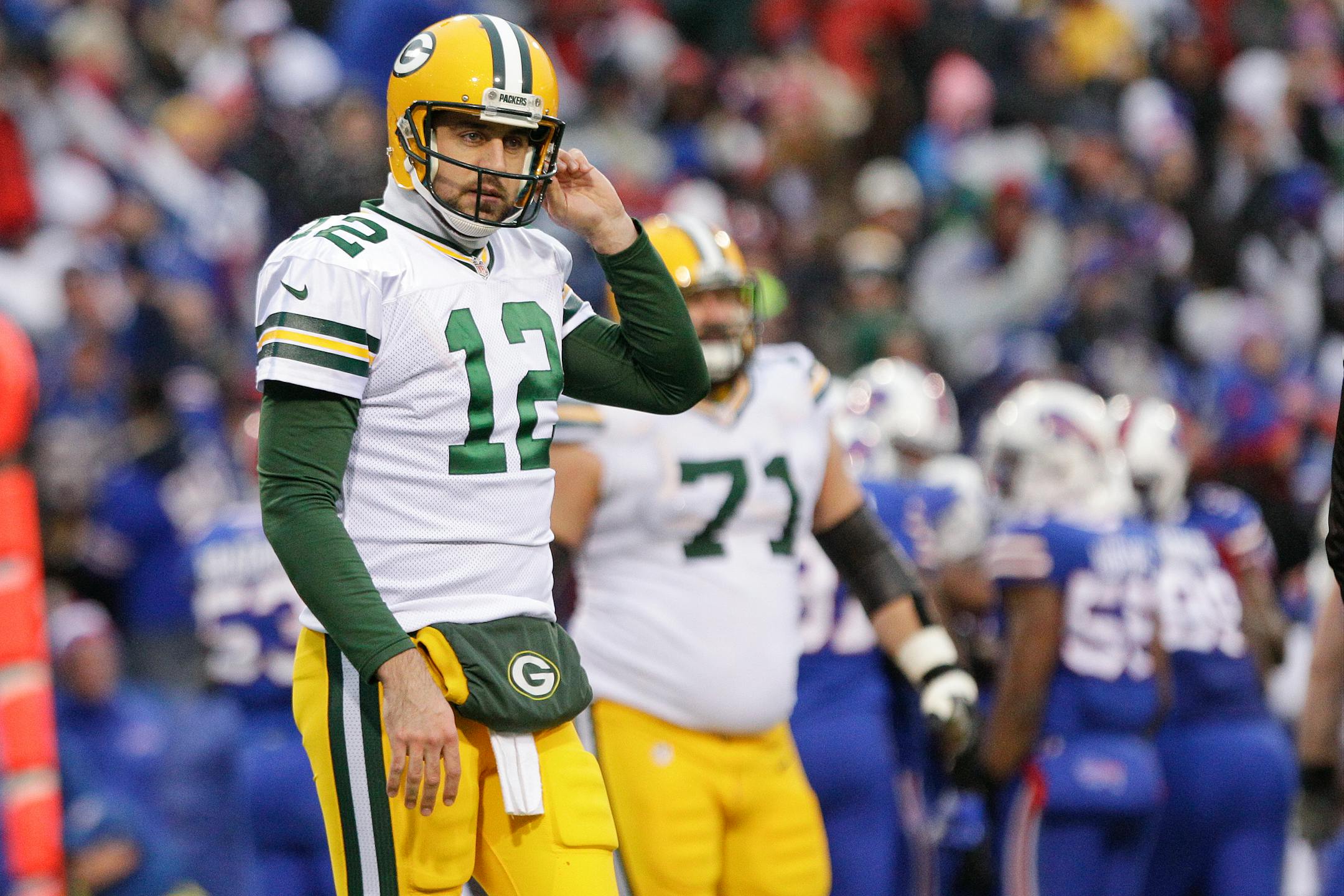Green Bay Packers quarterback Aaron Rodgers (12) reacts after throwing an interception during the second half of an NFL football game against the Buffalo Bills Sunday, Dec. 14, 2014, in Orchard Park, N.Y. (AP Photo/Bill Wippert)
