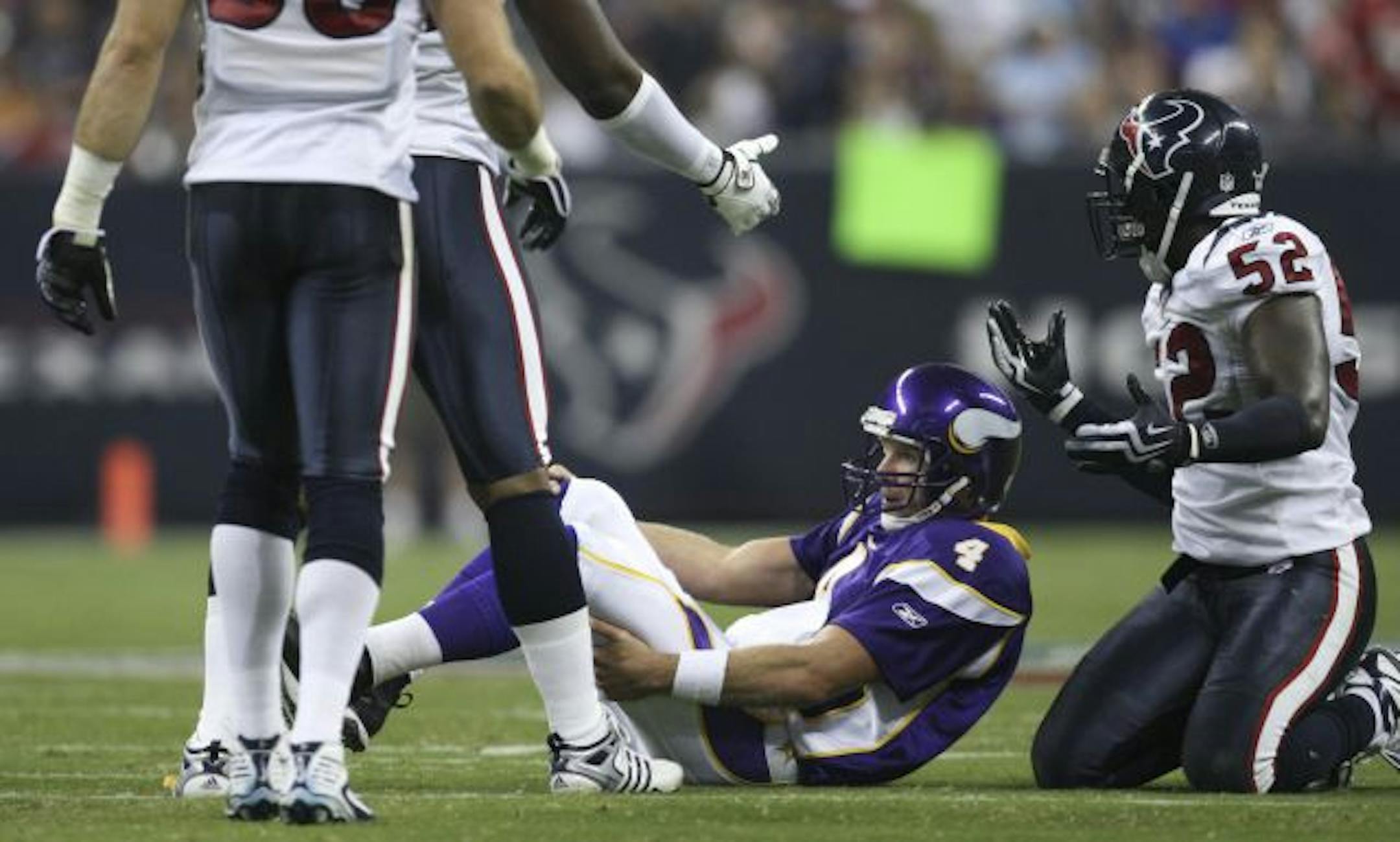 Houston's Xavier Adibi was called for roughing the passer in the second quarter after hitting quarterback Brett Favre.