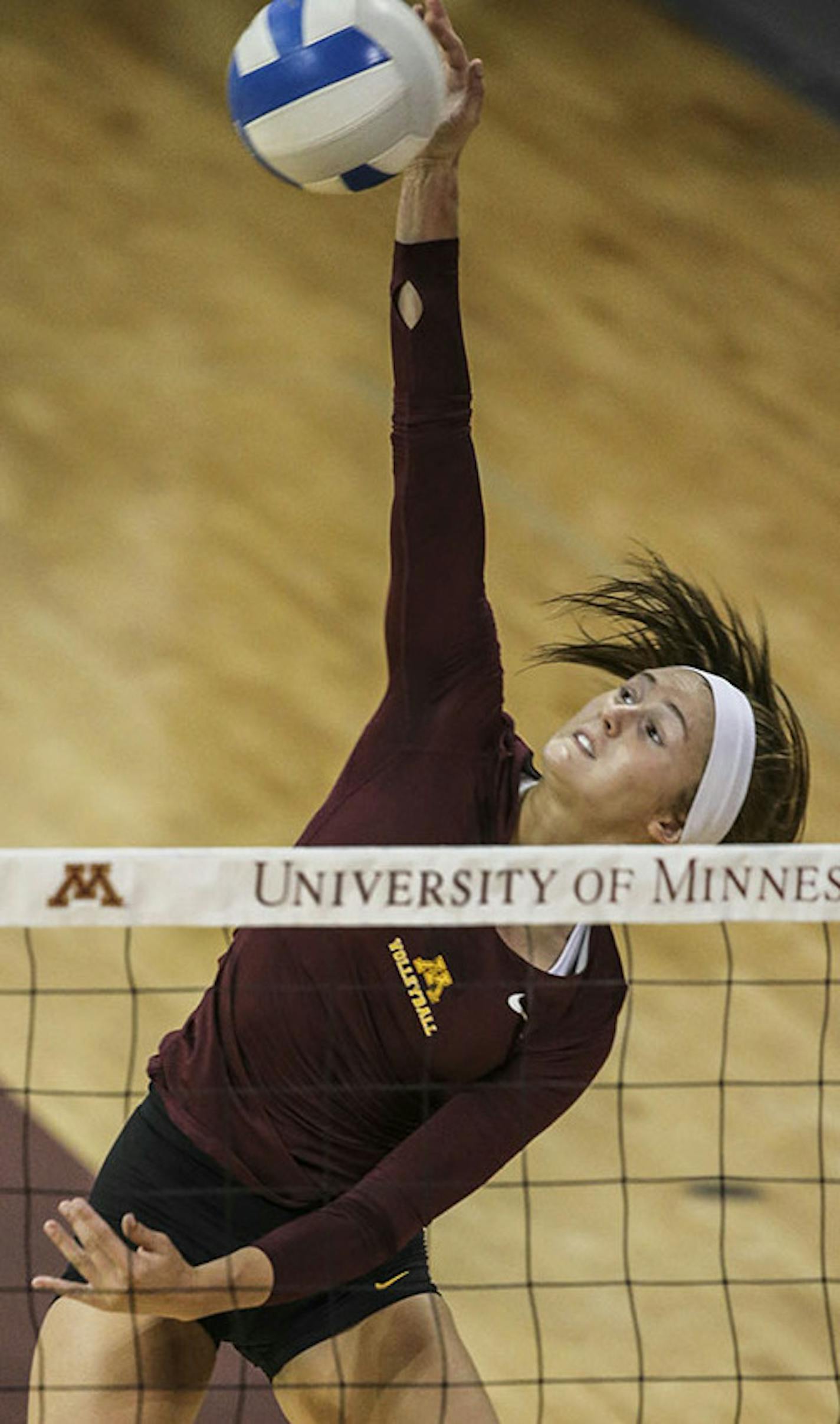 University of Minnesota's Alyssa Goehner spikes during practice at the Sports Pavillion.