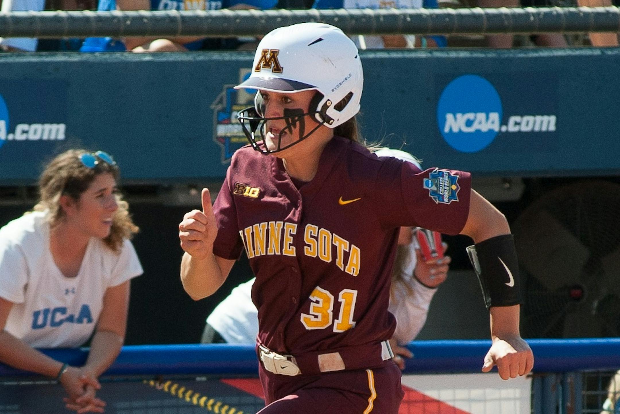 Minnesota Gophers #31Natalie DenHartog rounding third base running home versus UCLA at the 2019 Women's College World Series at the Softball Hall of Fame in Oklahoma City ORG XMIT: TP101 ORG XMIT: MIN1905301719561905