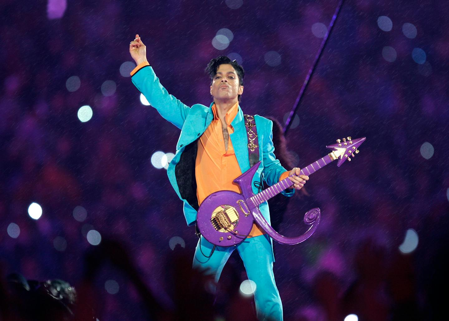 FILE - In this Feb. 4, 2007 file photo, Prince performs during the halftime show at the Super Bowl XLI football game at Dolphin Stadium in Miami. The halftime show has become one of the year's top cultural moments, so anticipated that it is commonly seen by more people than the game itself. (AP Photo/Chris O'Meara, File)