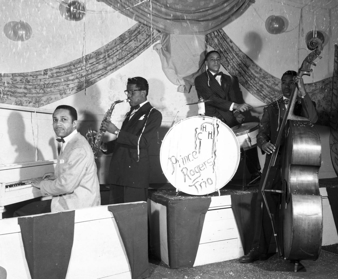 On weekends, John L. Nelson, left, who billed himself as the Fabulous Prince Rogers, played piano at Twin Cities nightclubs and strip joints.