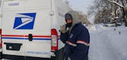 Wearing two of just about everything, Tyler Clendenen put in another long, cold day making deliveries for the U.S. Postal Service.