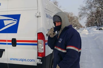 Wearing two of just about everything, Tyler Clendenen put in another long, cold day making deliveries for the U.S. Postal Service.