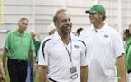 In this Sept. 6, 2014 photo shows Chris Cline, center, Chad Pennington, right, and Mike D'Antoni, left, arrive as Marshall University dedicates the ne