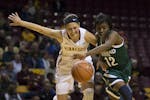 Cleveland State's Brooke Smith steals the ball from Gopher's Shayne Mullaney in the 1st half.