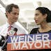 Huma Abedin, alongside her husband, New York mayoral candidate Anthony Weiner, speaks during a news conference at the Gay Men's Health Crisis headquar