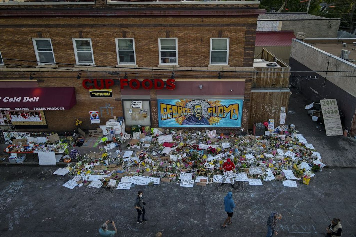 A memorial at East 38th Street and Chicago outside Cup Foods, where George Floyd died in police custody last Monday night.