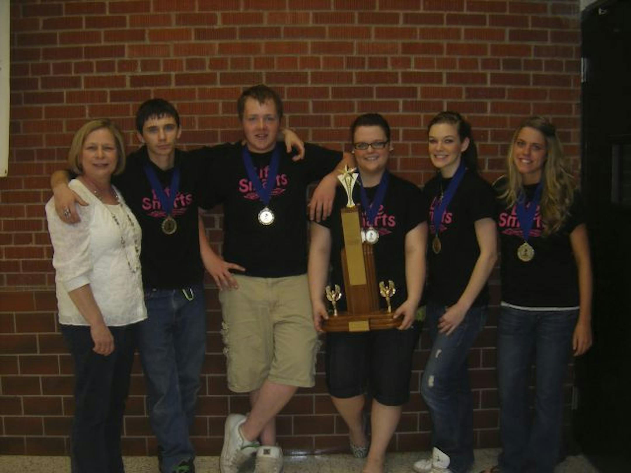 Teacher Lois Johnson, left, Brandon Good, Steven Prachar, Tylor Herzog, Shelby Disterhaupt and Camille Blechinger.