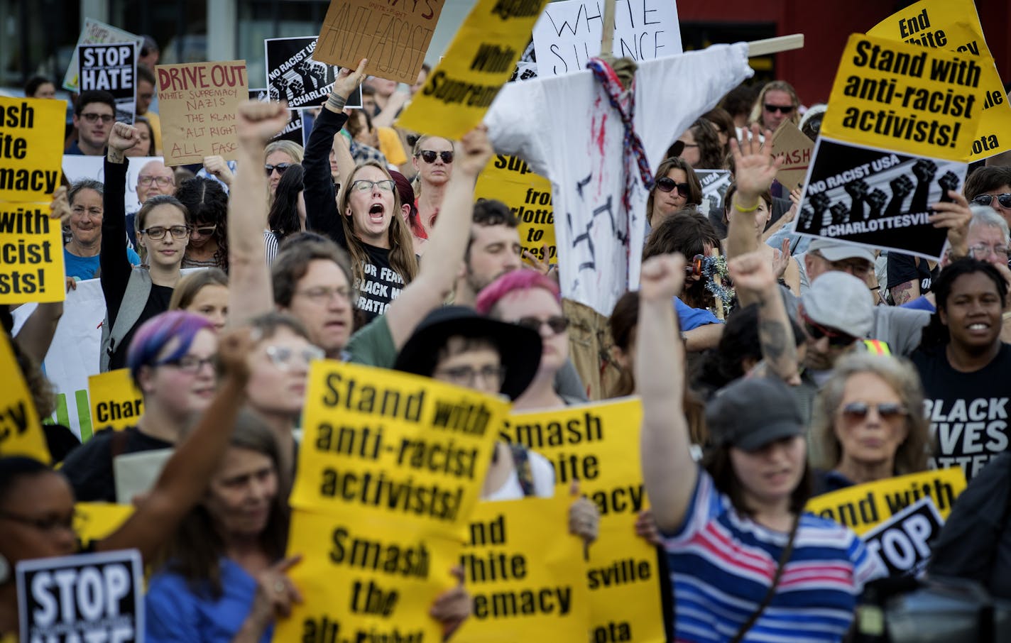 Demonstrators gathered at the Solidarity with anti-racists in Charlottesville in front of the Minneapolis Republican Party office on Franklin Avenue on Monday. ] CARLOS GONZALEZ &#x2022; cgonzalez@startribune.com - August 14, 2017, Minneapolis, MN, Solidarity march with anti-racists in Charlottesville. Starts at Republican HQ