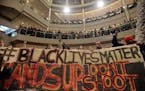 Demonstrators filled the Mall of America rotunda and chanted "Black lives matter" to protest police brutality, Saturday, Dec. 12, 2014, in Bloomington