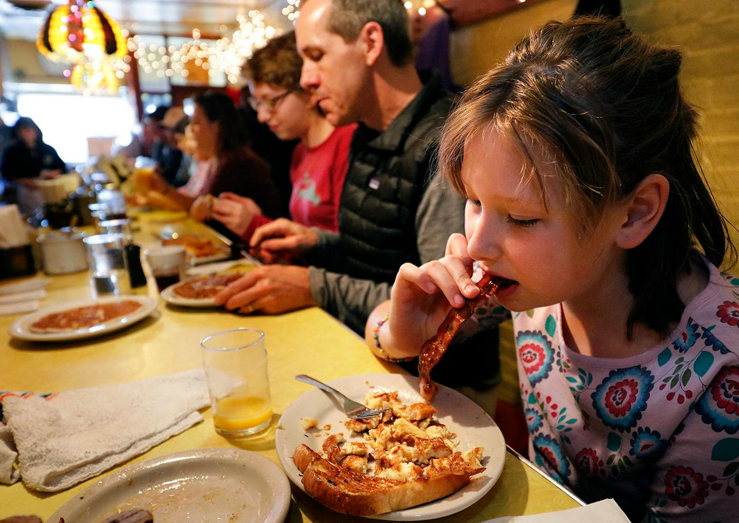 Sophie Vandercook enjoys bacon on her first visit to Al's. Her grandmother has been an Al's regular since 1987.