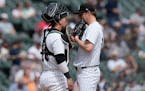 White Sox catcher Korey Lee, left, talks with starting pitcher Erick Fedde during the fourth inning Sunday.