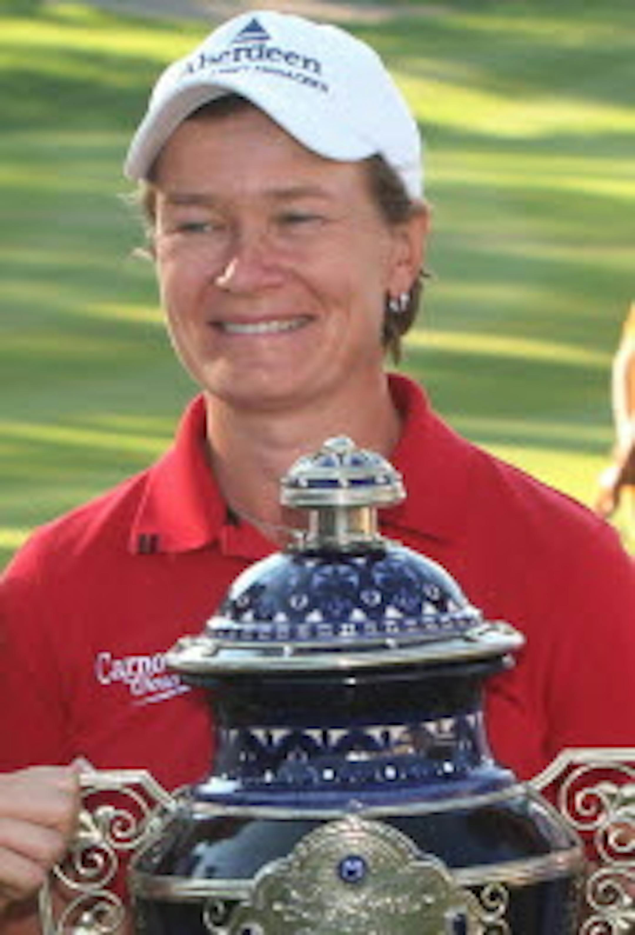 Scotland's Catriona Matthew held her trophy after winning the Lorena Ochoa Invitational in Guadalajara, Mexico, on Sunday.