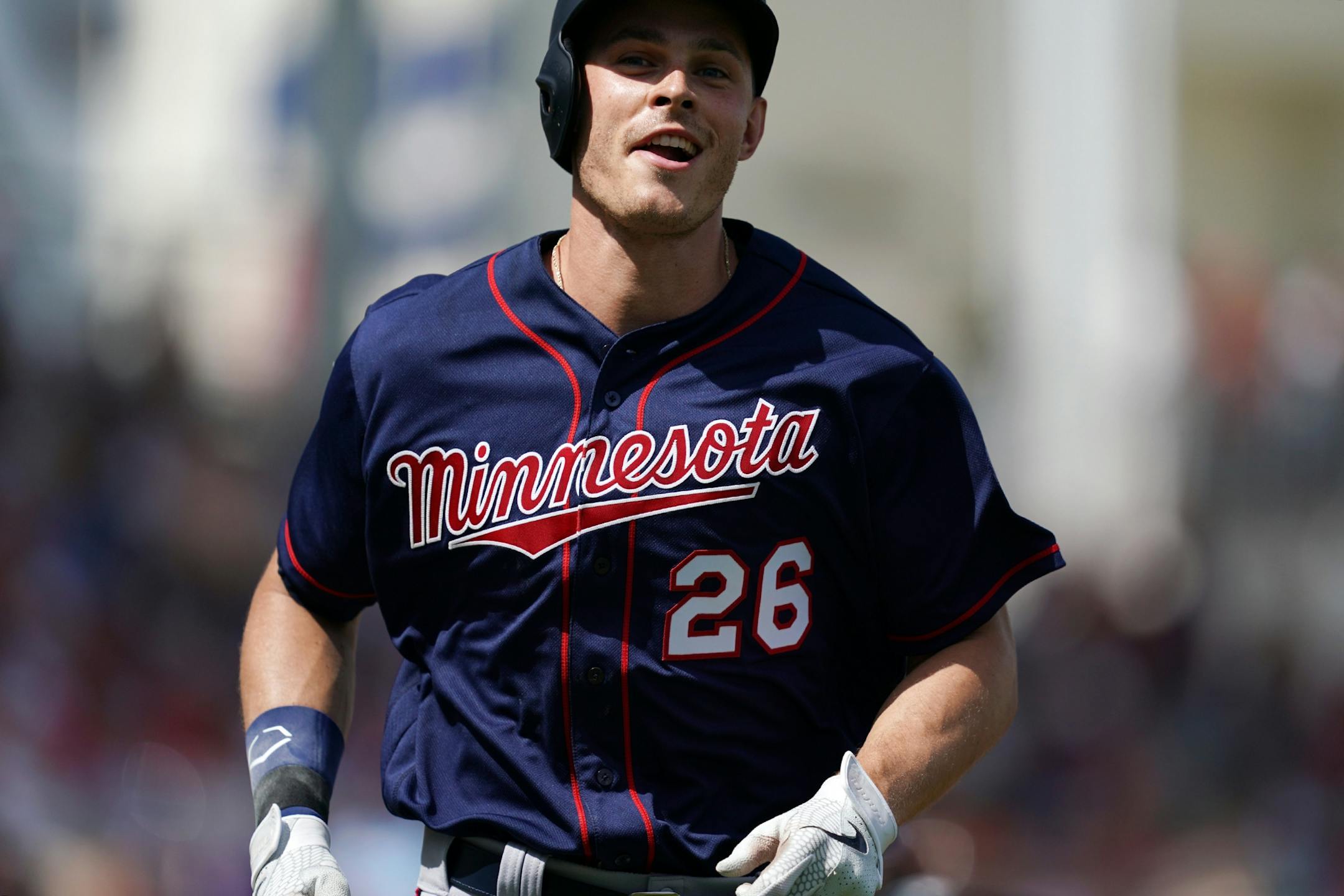 Minnesota Twins right fielder Max Kepler (26) smiled as he ran back into the dugout after hitting a home run in his first at bat during Sunday's game.