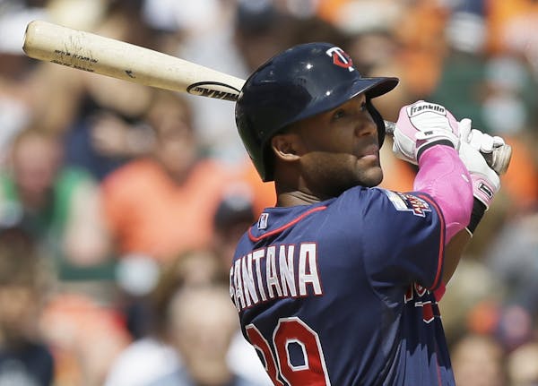 Minnesota Twins' Danny Santana watches his RBI single to Detroit Tigers right fielder Torii Hunter during the seventh inning of a baseball game in Det