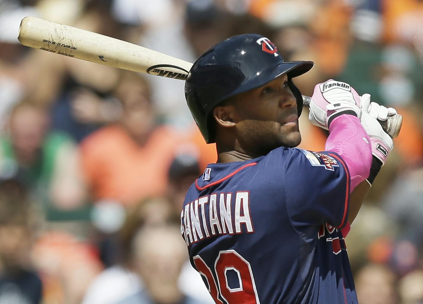 Minnesota Twins' Danny Santana watches his RBI single to Detroit Tigers right fielder Torii Hunter during the seventh inning of a baseball game in Detroit, Sunday, May 11, 2014. (AP Photo/Carlos Osorio)