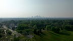Wildfire smoke hangs over the Minneapolis skyline on Monday as winds pushed a band of heavy smoke south from fires burning in British Columbia.