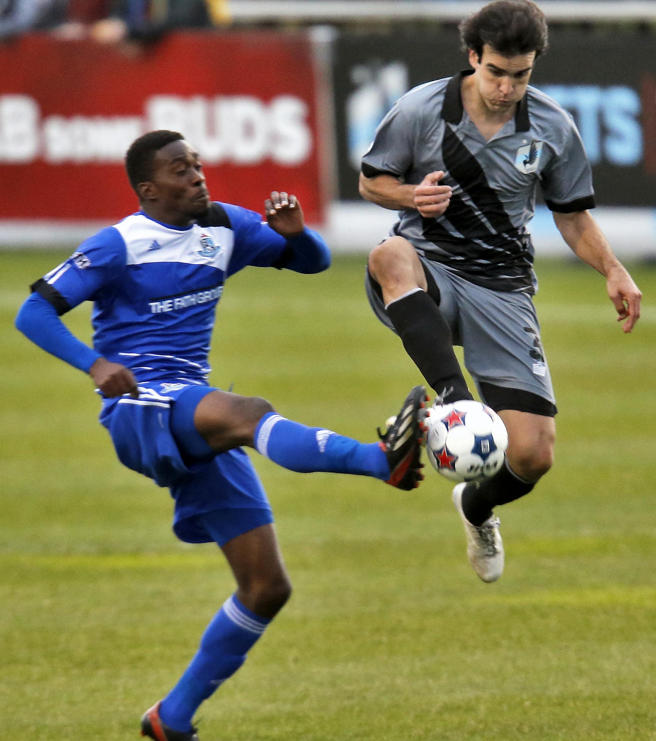 Edmonton's Lance Laing, left and United's Cristiano Dias fought for control of the ball. ] United vs. Edmonton soccer (MARLIN LEVISON/STARTRIBUNE(mlevison@startribune.com)