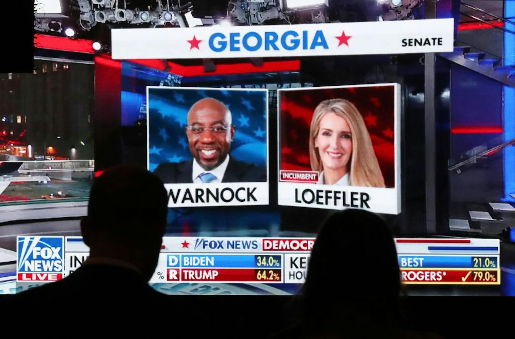 Republican supporters watch returns for Democratic U.S. Senate candidate Raphael Warnock and Republican incumbent Kelly Loeffler come in at the Georgia Republican Party Election Night Celebration Party at the Intercontinental Buckhead Atlanta hotel on Tuesday, Nov. 3, 2020, in Atlanta.