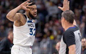 Wolves center Karl-Anthony Towns reacts after making a three-pointer in the second quarter against the Denver Nuggets on Monday night. He had 27 point