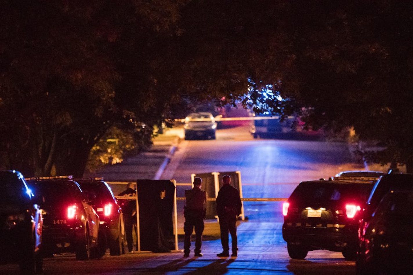 St. Paul Police and the Minnesota BCA investigate an officer involved shooting crime scene on Euclid Street.