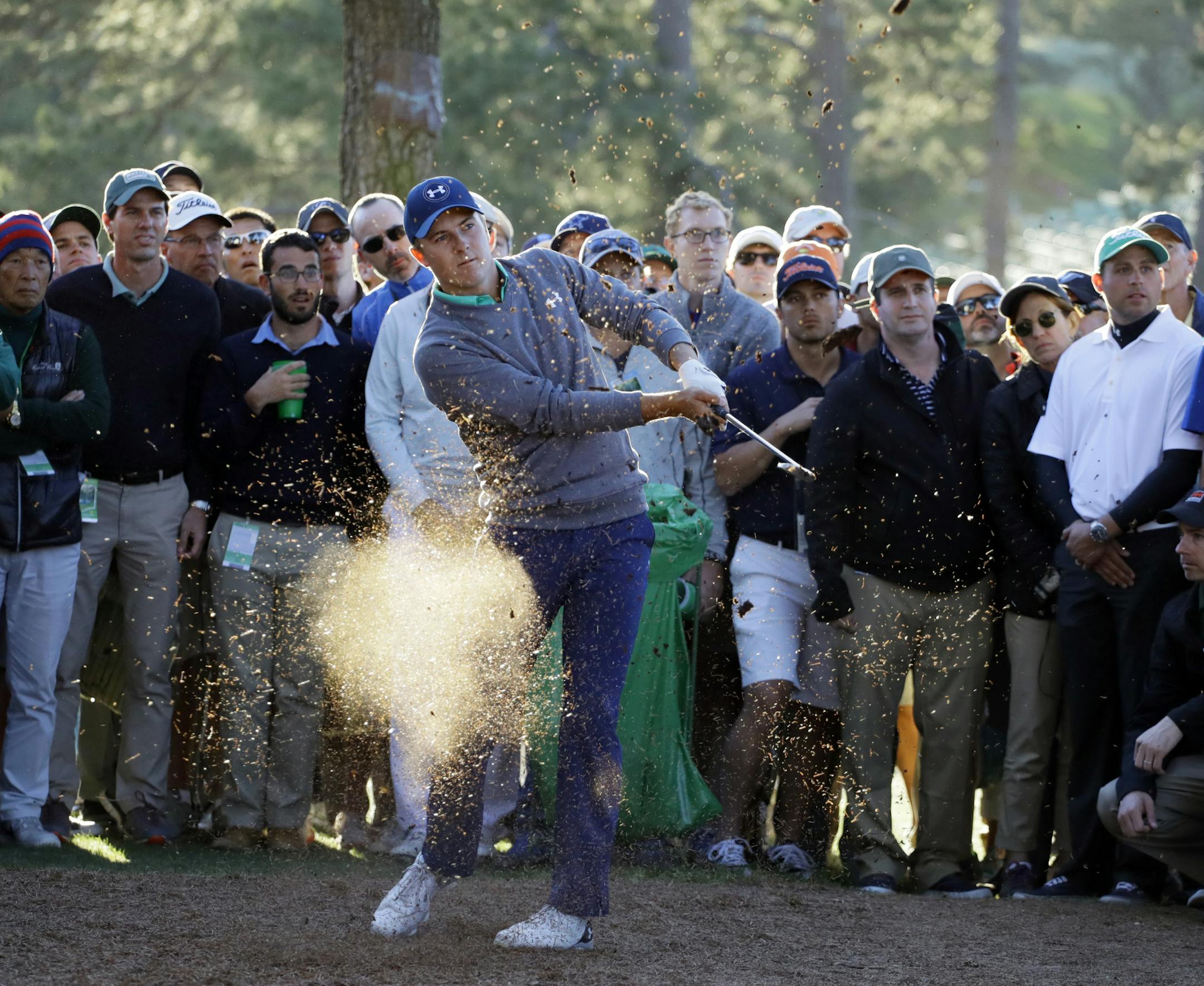 Jordan Spieth hits out of the rough off the 17th fairway during the third round of the Masters golf tournament Saturday, April 9, 2016, in Augusta, Ga. (AP Photo/Matt Slocum)