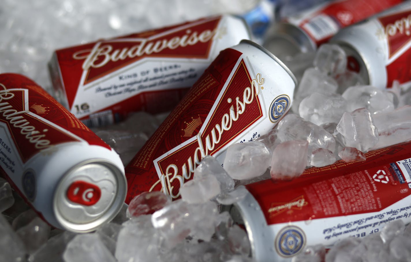 FILE - In this Thursday, March 5, 2015, file photo, Budweiser beer cans are seen at a concession stand at McKechnie Field in Bradenton, Fla. A British court has ruled that two groups of SABMiller shareholders should vote separately on Anheuser-Busch InBev&#x2019;s 79 billion pound ($104 million) takeover, effectively giving smaller investors the outside chance to derail the deal. he decision Tuesday, AUG. 23, 2016 is seen as a concession to smaller shareholders who complained that their payout p