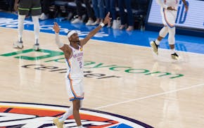 Shai Gilgeous-Alexander celebrates as the Thunder pull away in the fourth quarter on Tuesday night in Oklahoma City to beat the Timberwolves.