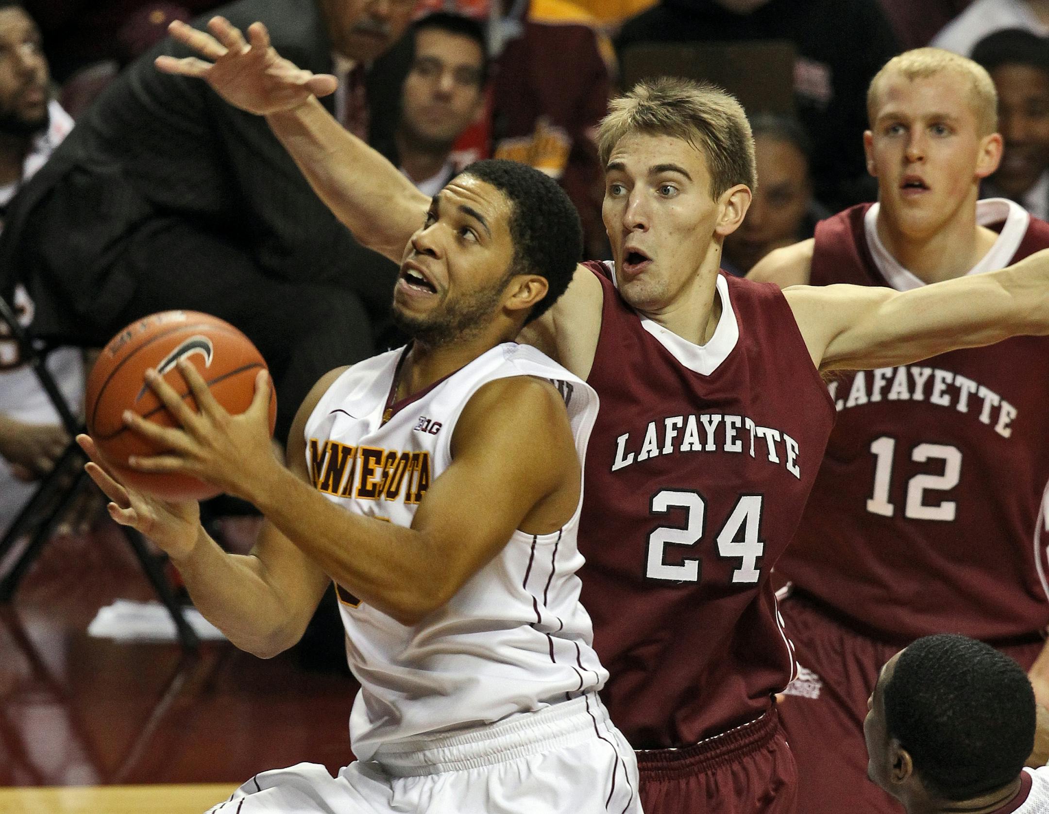 The Gophers' Julian Welch drove past Lafayette's Levi Giese (24) for a second-half half layup on Saturday night at Williams Arena.