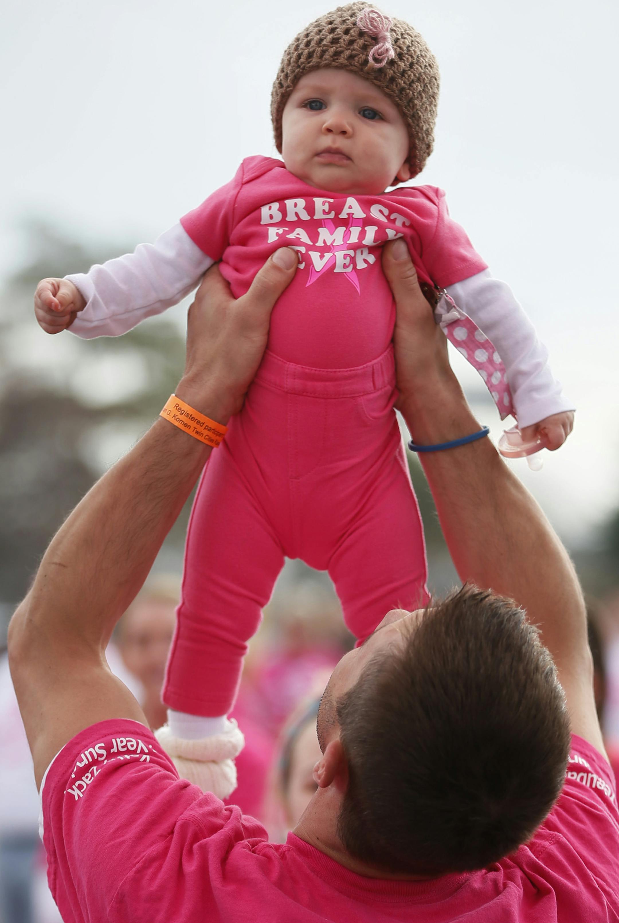Larry Young of St. Paul brought his 8-month old daughter, Eleanor, to join 24 other family members for the walk.