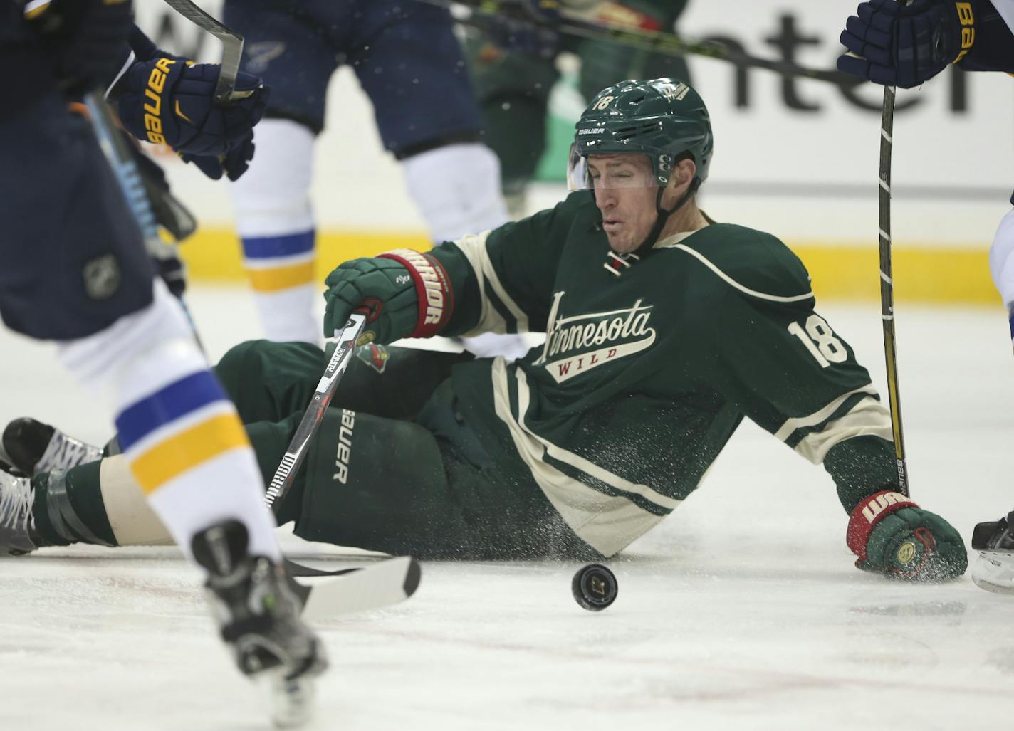 Wild center Ryan Carter (18) was dropped to the ice in front of the St. Louis net in the first period Sunday night. ] JEFF WHEELER &#xef; jeff.wheeler@startribune.com The Minnesota Wild faced the St. Louis Blues in an NHL hockey game Sunday night, March 6, 2016 at Xcel Energy Center in St. Paul. ORG XMIT: MIN1603062003500329