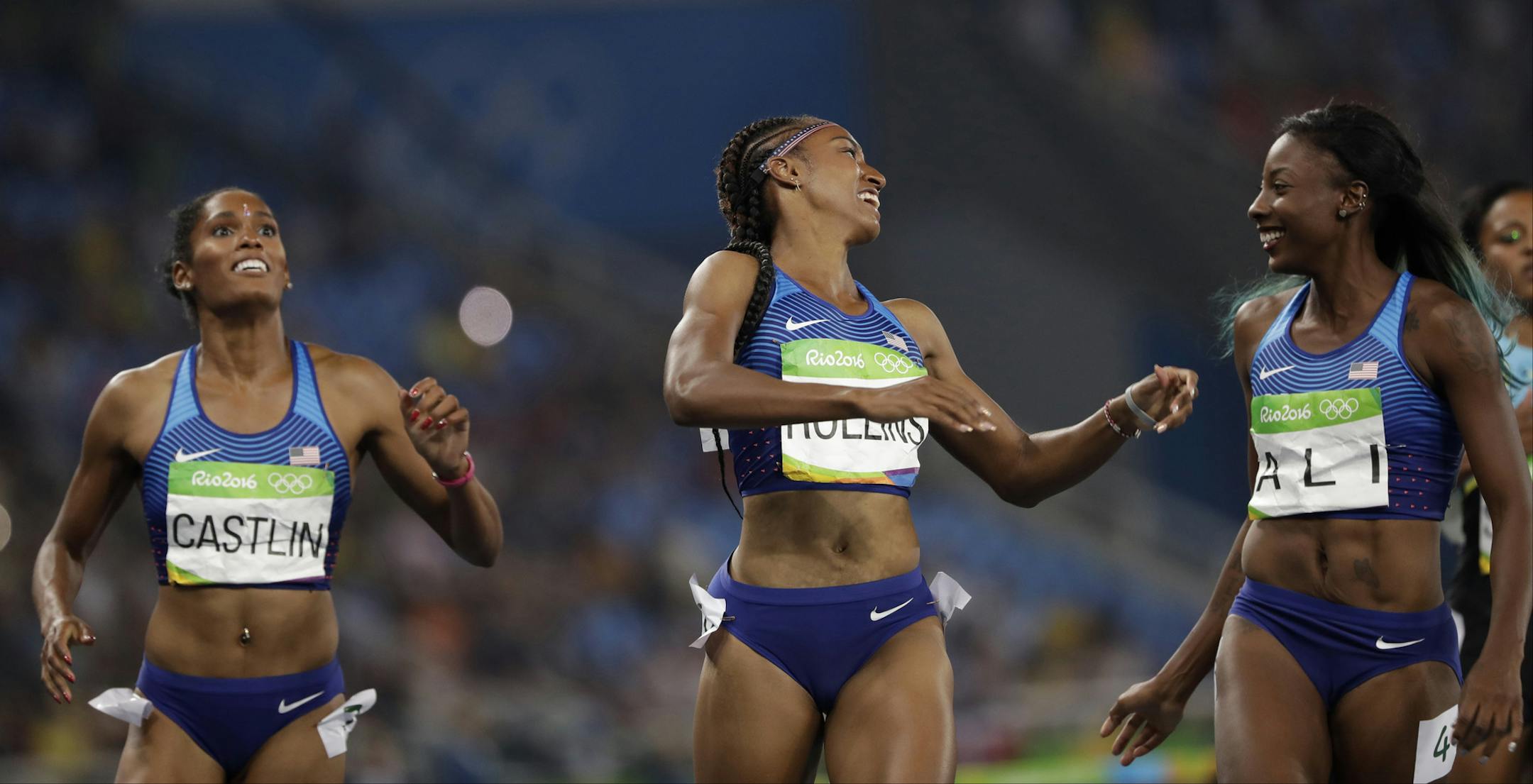 Brianna Rollins from the United States, center, celebrates winning the gold medal in the women's 100-meter hurdles final ahead of second placed United States' Nia Ali, right, and third placed United States' Kristi Castlin during the athletics competitions of the 2016 Summer Olympics at the Olympic stadium in Rio de Janeiro, Brazil, Wednesday, Aug. 17, 2016. (AP Photo/David J. Phillip) ORG XMIT: OATH380