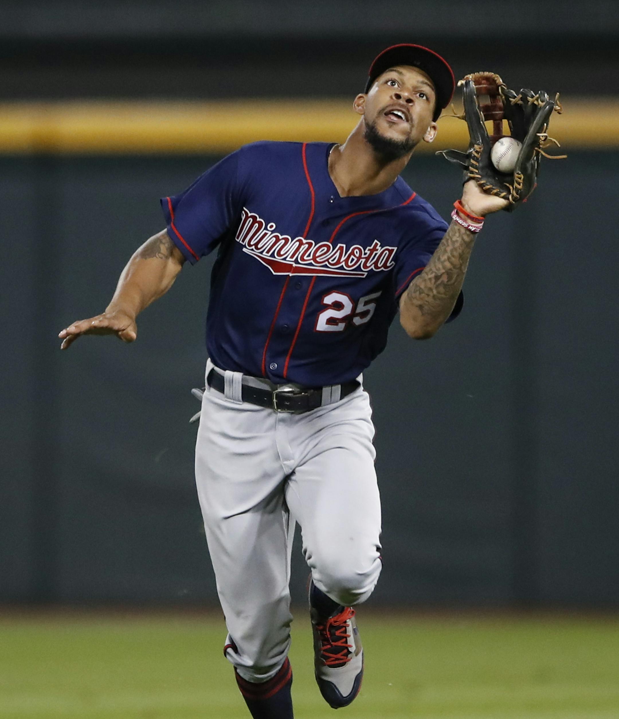 Minnesota Twins' Byron Buxton catches the ball hit by Chicago White Sox' Avisail Garcia during the seventh inning of game two of a baseball doubleheader Monday, Aug. 21, 2017, in Chicago. (AP Photo/Kamil Krzaczynski)