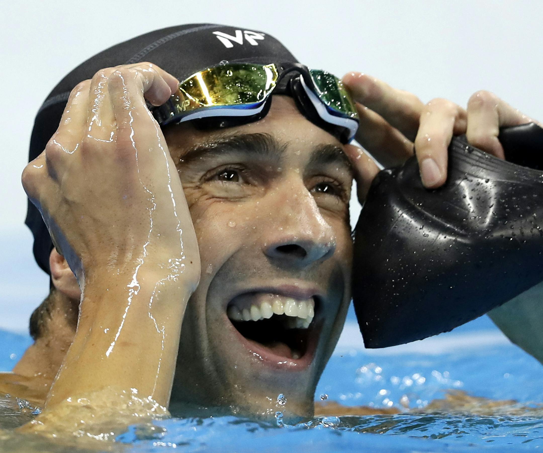 United States' Michael Phelps reacts after the men's 100-meter butterfly final during the swimming competitions at the 2016 Summer Olympics, Friday, Aug. 12, 2016, in Rio de Janeiro, Brazil. (AP Photo/Michael Sohn)