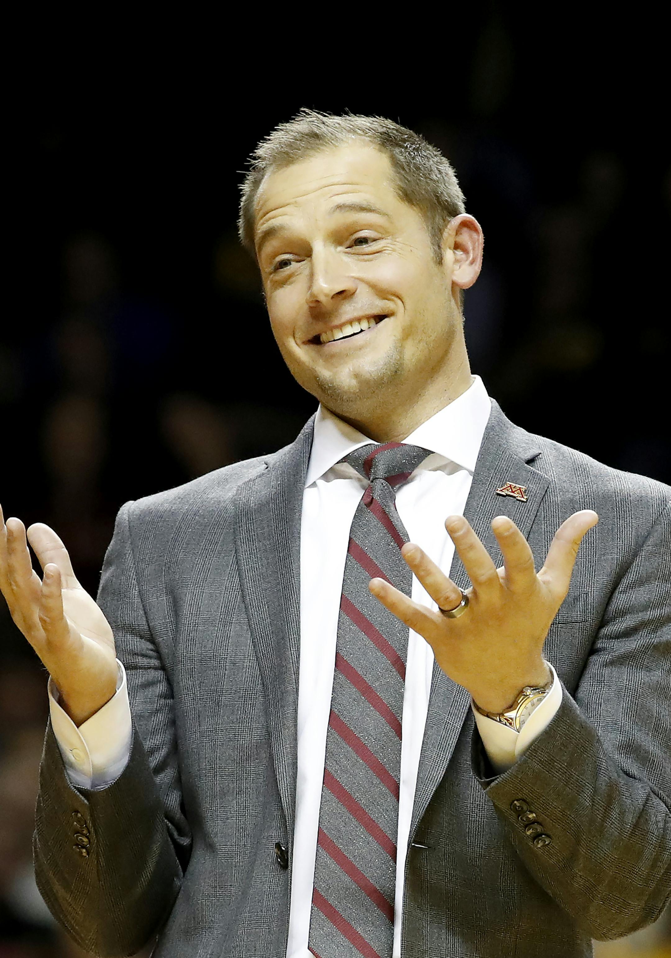 Minnesota Gophers head football coach P.J. Fleck addresses the crowd and helped the half time entertainment act Red Panda at William Arena. ] CARLOS GONZALEZ cgonzalez@startribune.com - January 8, 2017, Minneapolis, MN, Williams Arena, NCAA Basketball, University of Minnesota Gophers vs. Ohio State Buckeyes