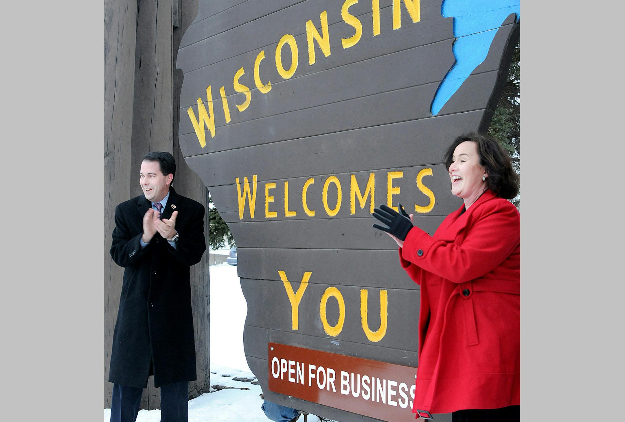 In 2011, Wisconsin Gov. Scott Walker and tourism secretary Stephanie Klett touted Walker’s policies by adding an “Open for Business” sign to a “welcome” sign.