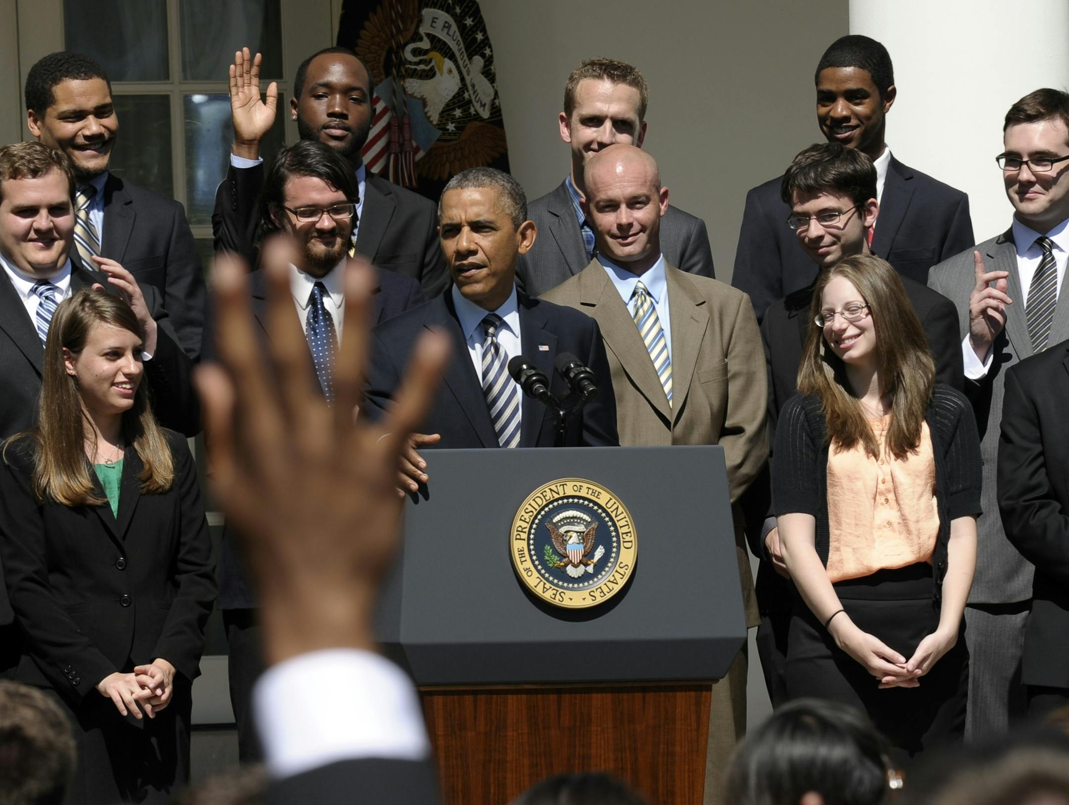 The audience responds to a question asked by President Barack Obama, joined by college students, during his remarks in the Rose Garden of the White House in Washington, Friday, May 31, 2013, where he called on Congress to keep federally subsidized student loans rates from doubling on July 1.(AP Photo/Susan Walsh)
