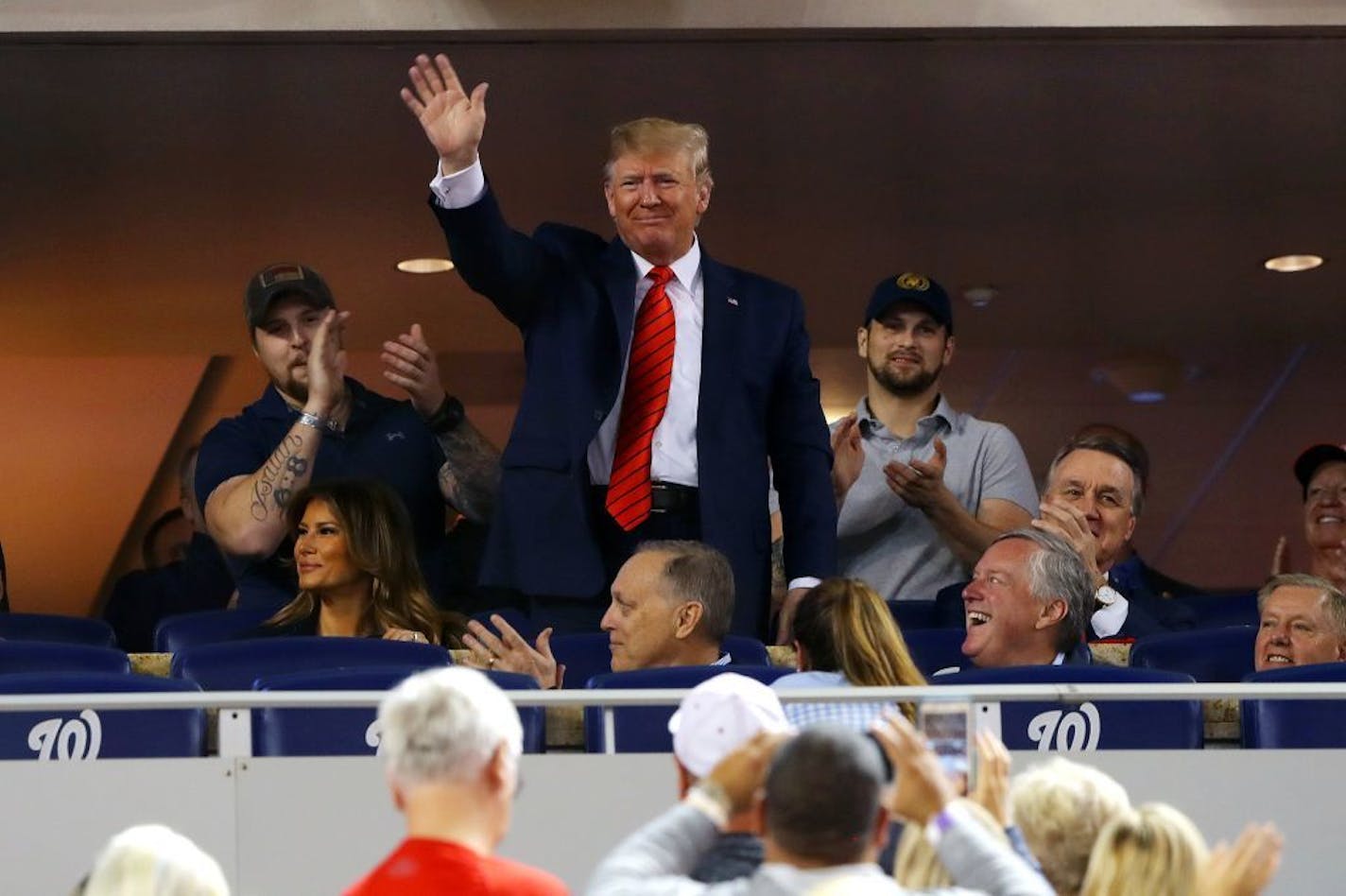 U.S. President Donald Trump acknowledges the crowd during Game 5 of the 2019 World Series between the Houston Astros and the Washington Nationals on Sunday, Oct. 27, 2019 at Nationals Park in Washington, D.C.