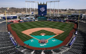 Members of the Kansas City Royals' grounds crew work off the field in preparation for the 2023 baseball season Wednesday, March 29, 2023, at Kauffman 