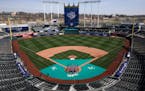 Members of the Kansas City Royals' grounds crew work off the field in preparation for the 2023 baseball season Wednesday, March 29, 2023, at Kauffman 