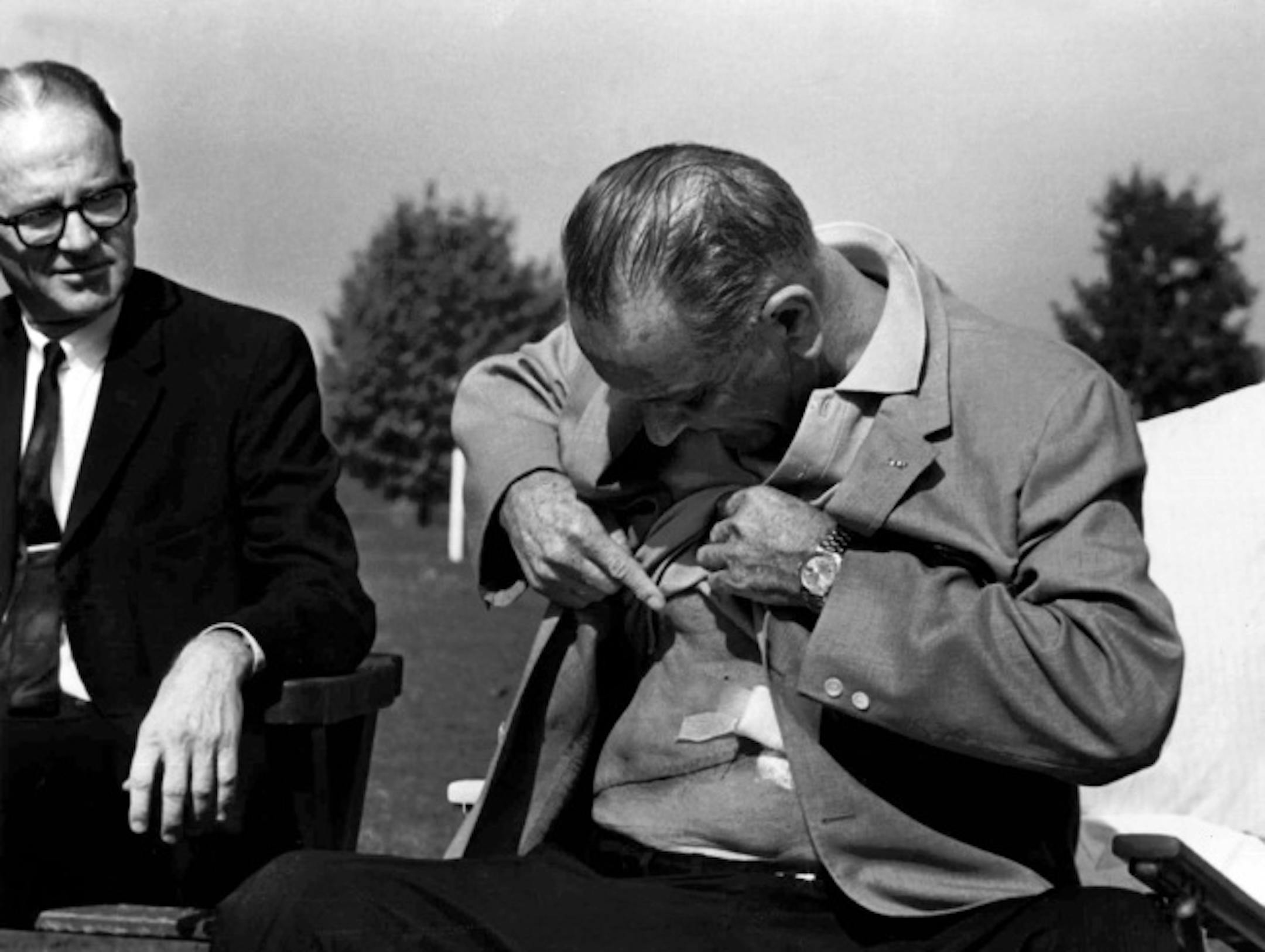 In this Oct. 20, 1965 black-and-white file photo, President Lyndon Baines Johnson displays the incision from his gall bladder surgery and kidney stone removal at a news conference at Bethesda Naval Hospital in Bethesda, Md. Woodrow Wilson's secret stroke. Grover Cleveland's secret cancer surgery. Franklin D. Roosevelt's secretly worsening heart disease at the world-changing Yalta Conference. Notice a lot of secrets?